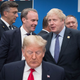 President Donald Trump with Foreign Secretary Dominic Raab and British Prime Minister Boris Johnson onstage during the annual NATO heads of government summit on December 4, 2019 in Watford, England.